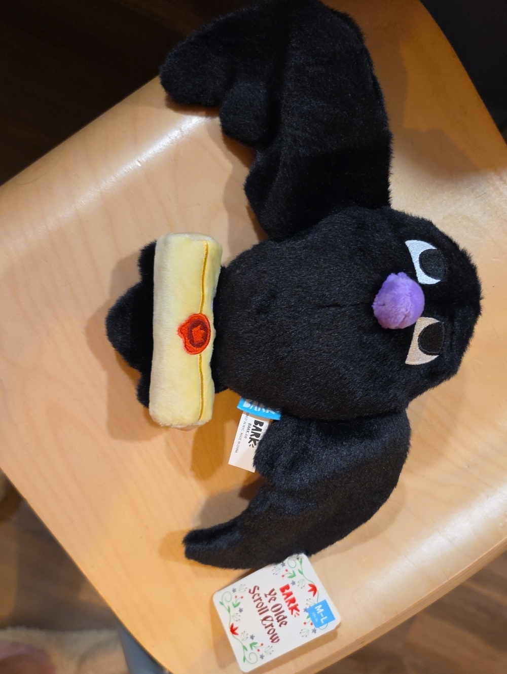 Black Plush Bat Dog Toy with Purple Nose and Yellow Accessory